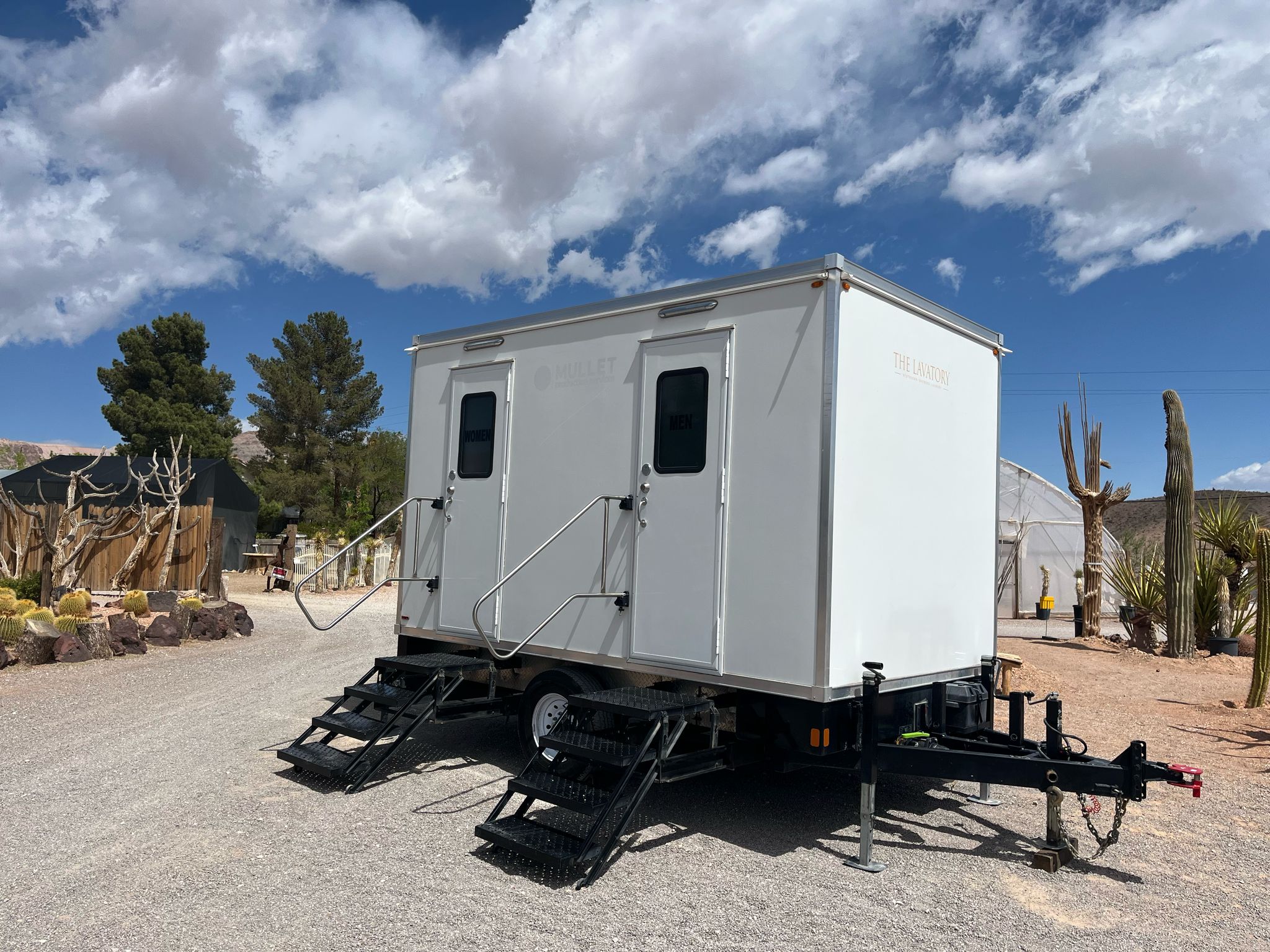 Texas wedding luxury restroom trailer rental. Elegant porcelain bathroom trailer at outdoor wedding venue