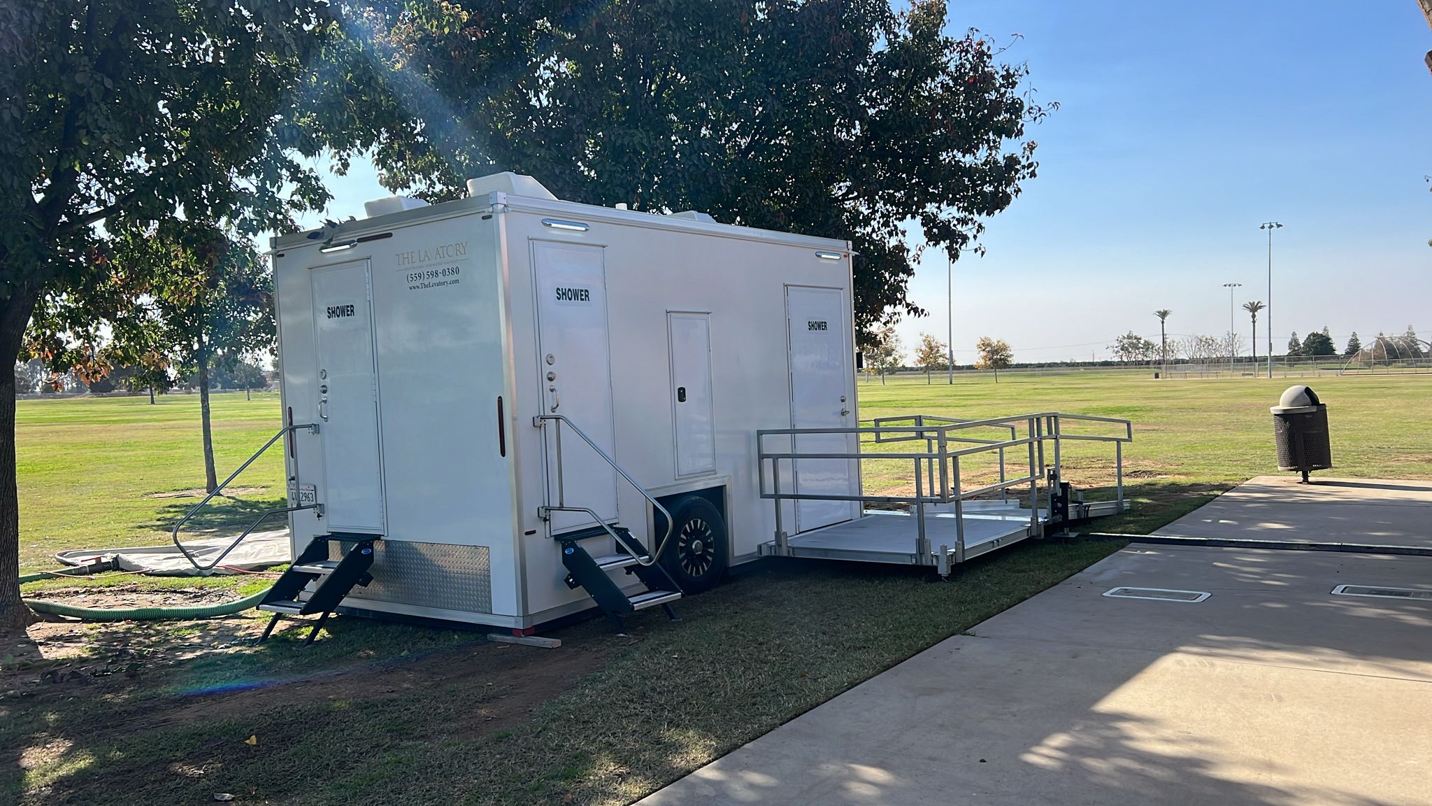 ADA plus 2 private shower trailer rental Texas. Wheelchair accessible shower trailer for homeless outreach and elderly programs